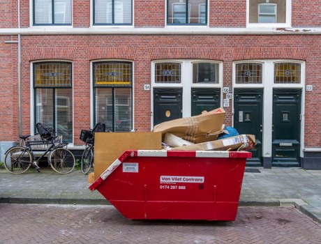 Professional team clearing garage clutter